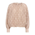 Beige bluse med lyse broderede prikker, ballonform og høje manchetter set forfra