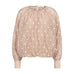 Beige bluse med lyse broderede prikker, ballonform og høje manchetter set forfra