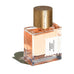 Sunset Hour parfume fra Goldfield & Banks i firkantet glasflaske med ferskenfarvet duft og låg med træstruktur