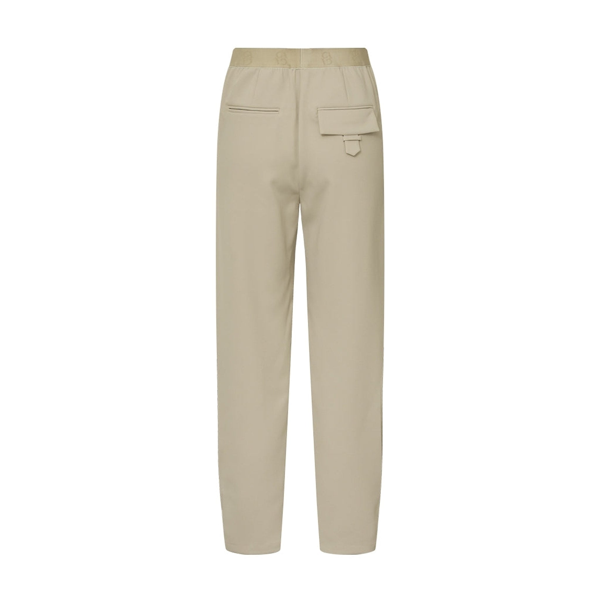 Beige Atalie Pants i Sand set bagfra med elastik i linningen og lomme med klap og strop