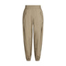 Beige bukser Mollie Pant i Light Camel fra Gossia set forfra med elastik i taljen, lommer og elastik ved anklen