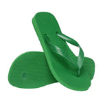 Par grønne Havaianas Top sandaler, hvor den ene viser undersålen med riller