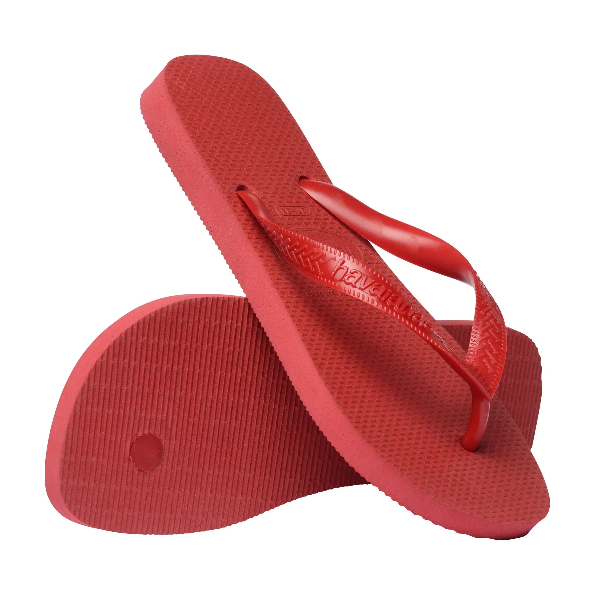 Røde Havaianas Top sandaler, hvor den ene viser undersiden af gummisålen