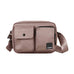 Beige crossbody-taske Miles fra Kintobe i Scandi Taupe forfra med to lommer foran og bred skulderrem med logo