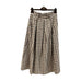 Brun ternet midinederdel fra Marta du Chateau med elastik i linningen og læg foran, hængende på bøjle forfra