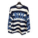 Nerina sweatshirt med brede mørkeblå og hvide striber og lyseblåt Copenhagen-print, set forfra på bøjle