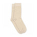 Et par beige strømper Lara Socks fra MP Denmark liggende fladt på hvid baggrund