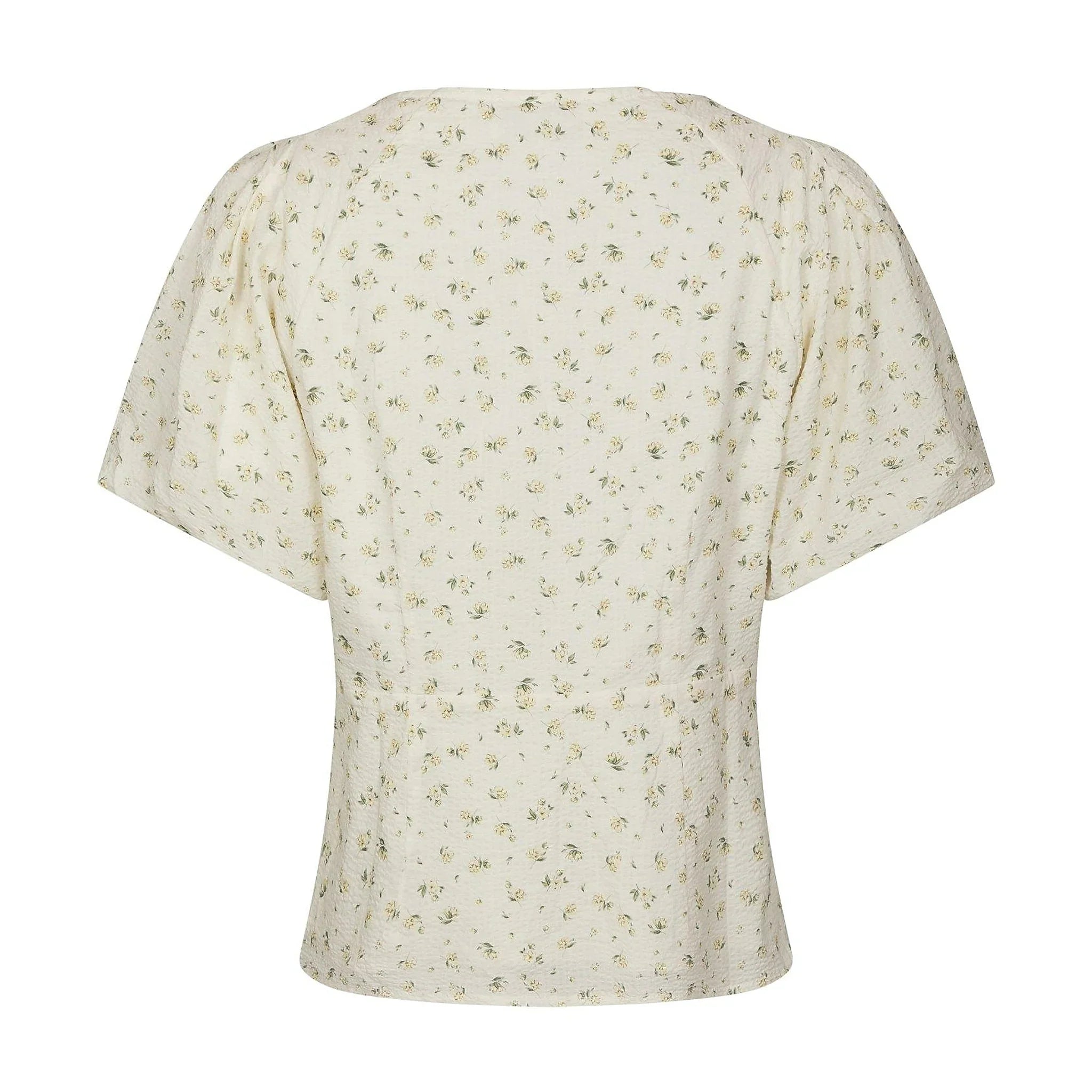 Lysegul blomstret bluse fra Neo Noir set bagfra med søm i taljen