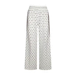 Hvide prikkede wide leg bukser fra Neo Noir med elastisk linning og fold foran, set forfra