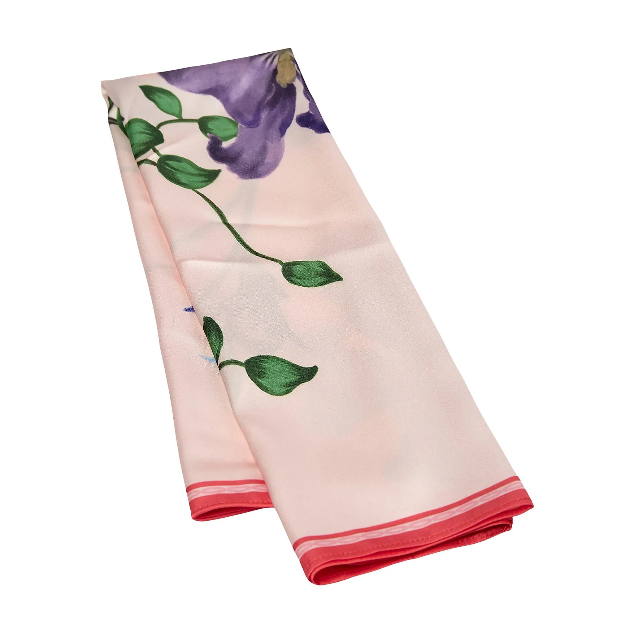 Pink satin tørklæde med blomsterprint foldet på langs, så den røde kant ses for enden
