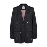 Navy oversize blazer med nålestriber og små hvide motiver set forfra med lyserødt for med prikker
