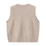 Beige vest i strik set bagfra med glat ryg og ribkant forneden
