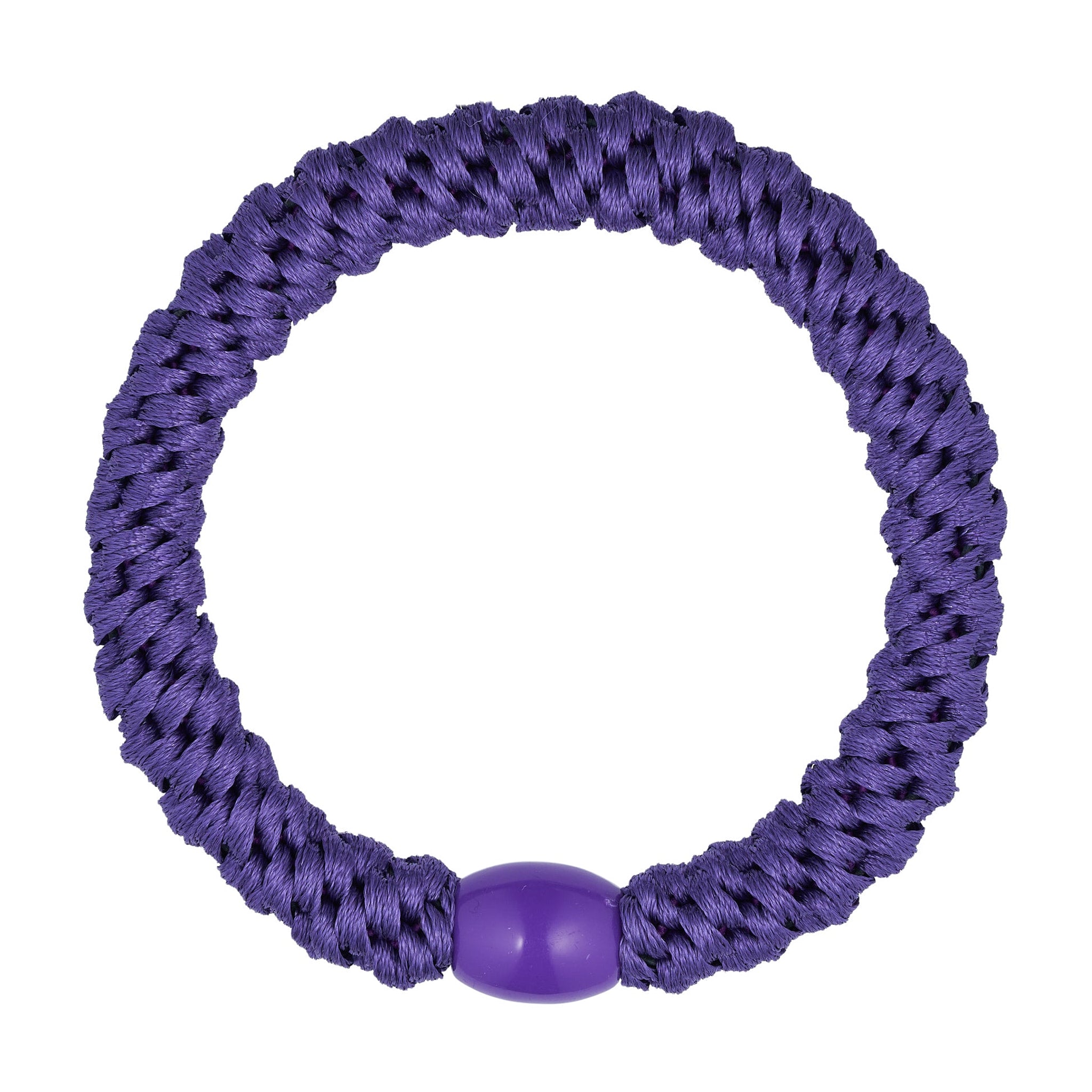 Lilla flettet hårelastik fra Wolff Jewelry med lilla perle i plastik, set ovenfra på lys baggrund