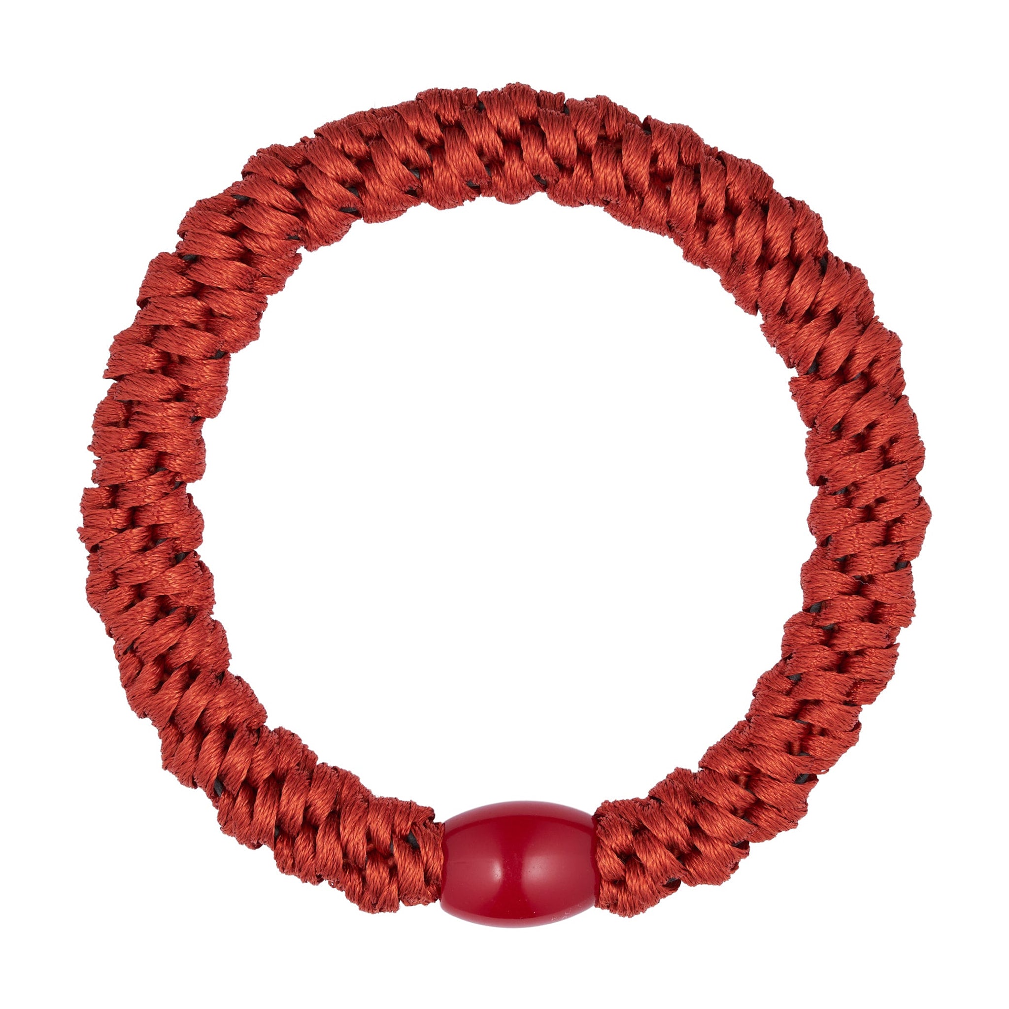 Orange hårelastik i farven Rust fra Wolff Jewelry med flettet overflade og blank rød perle, set ovenfra