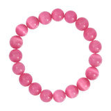 Pink armbånd Jusi Pearl Bracelet i Dark Rose med runde, blanke perler set ovenfra på lys baggrund