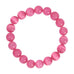 Pink armbånd Jusi Pearl Bracelet i Dark Rose med runde, blanke perler set ovenfra på lys baggrund