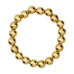 Lady Bracelet i guld fra Wolff Jewelry med store, blanke kugler og små ringe imellem, set ovenfra på hvid baggrund